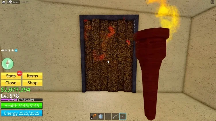 Burning a grass door with a torch in the desert
