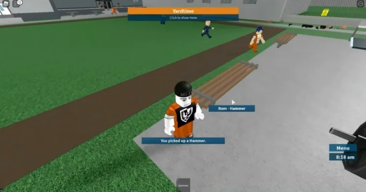 Picking up a hammer in the yard.